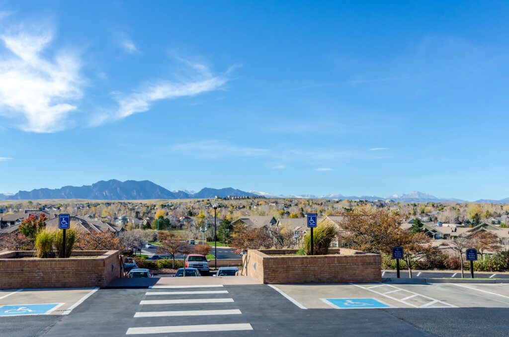 View from parking lot with mountains in the distance