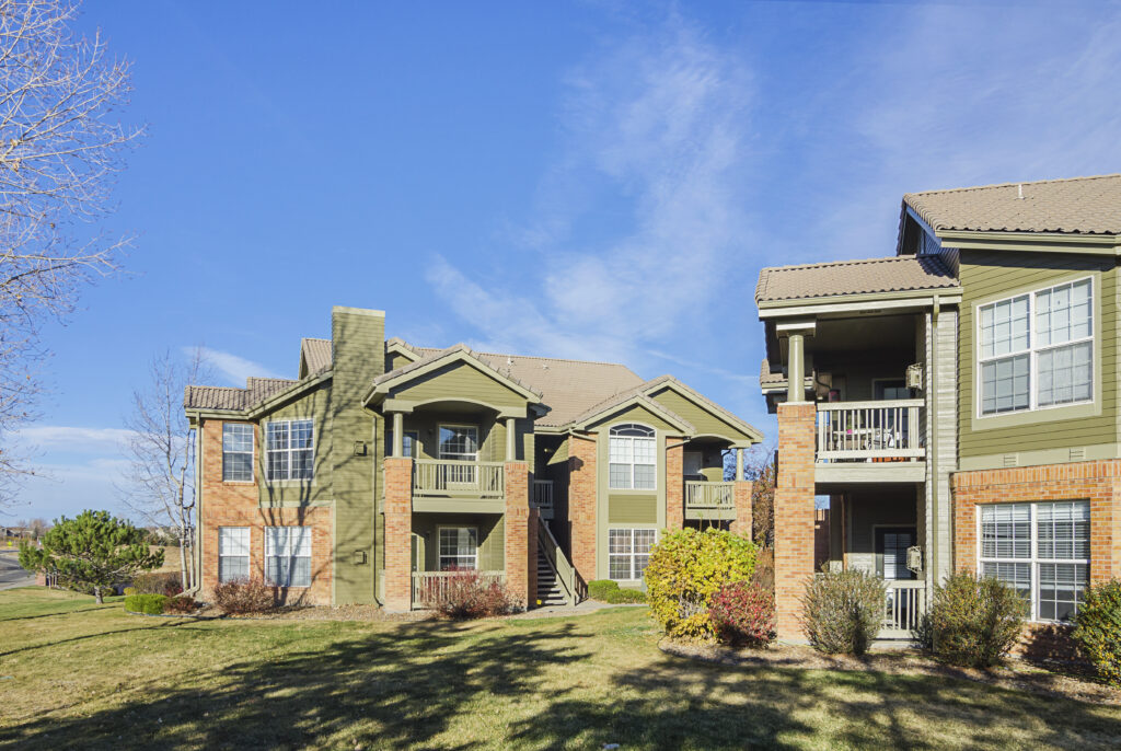 Building exteriors showing balconies and trees