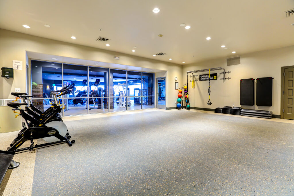 Fitness center with cardio equipment and functional training area