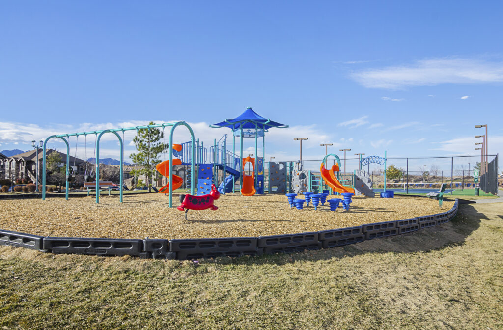 Children's playground with climbing, swings, and slides