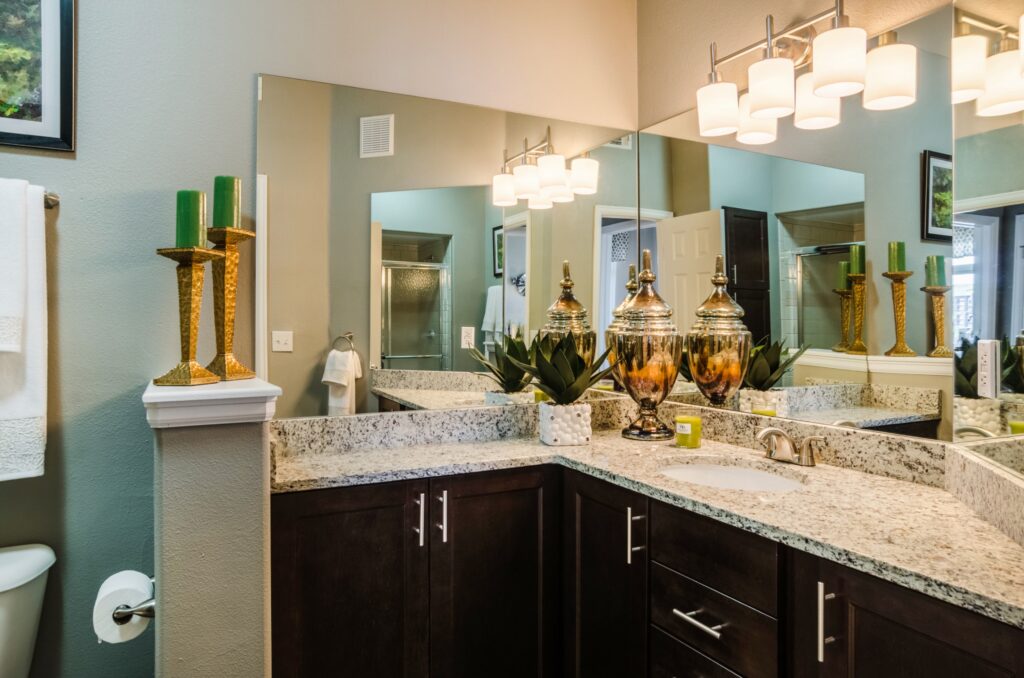 Bathroom with granite counters and glass shower